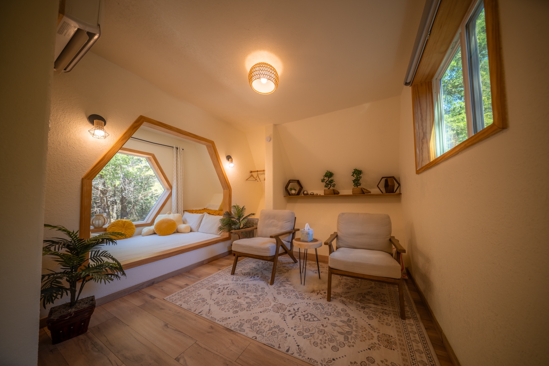 HoneyHive sitting area with cushioned chairs and a hexagonal window nook